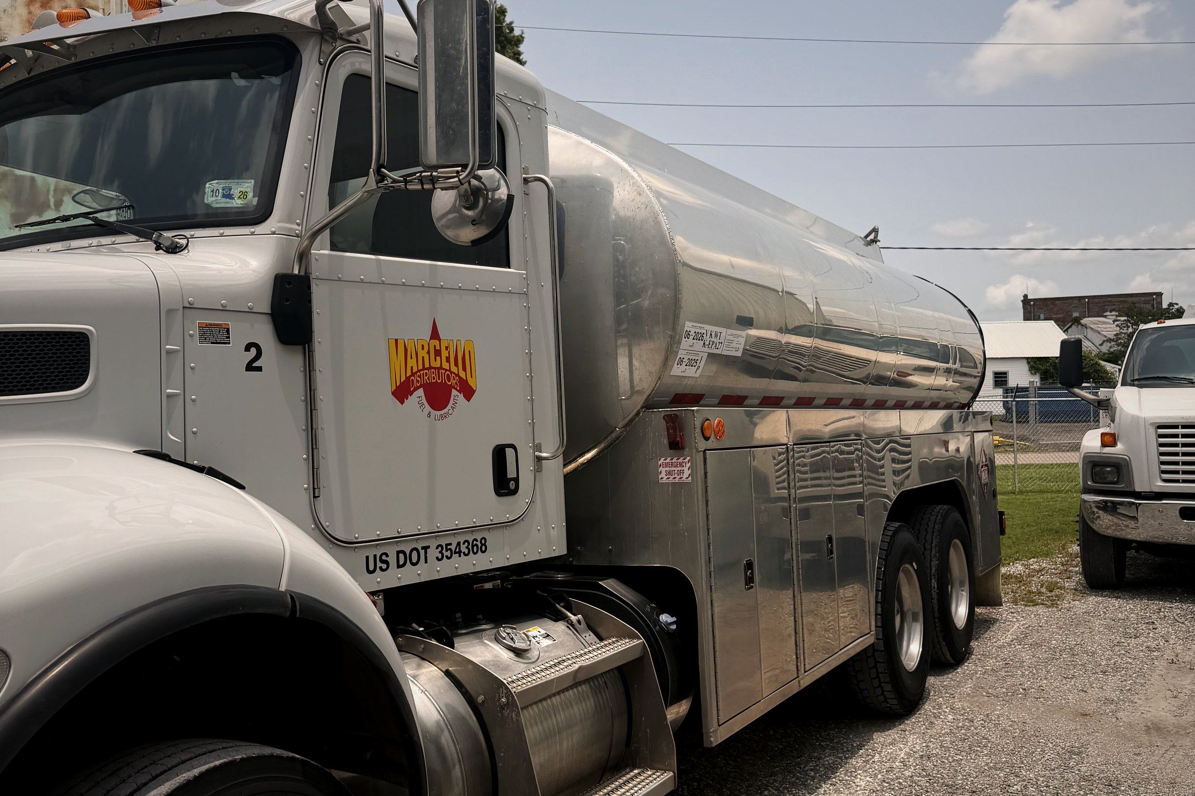 Marcello-branded stainless bulk fuel tanker parked at the yard